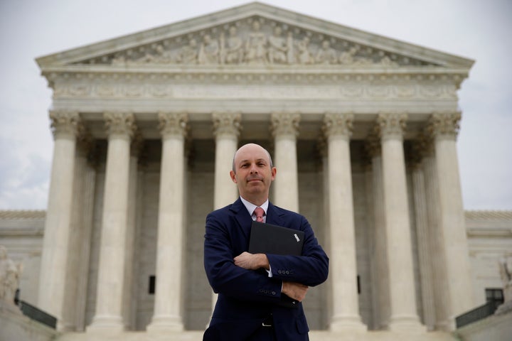 Tom Goldstein, who writes SCOTUSblog.com, poses for a photograph in front of the Supreme Court, Thursday, Oct. 31, 2013, in Washington.