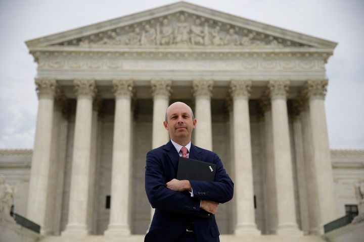 Tom Goldstein, who writes SCOTUSblog.com, poses for a photograph in front of the Supreme Court, Thursday, Oct. 31, 2013, in Washington. 