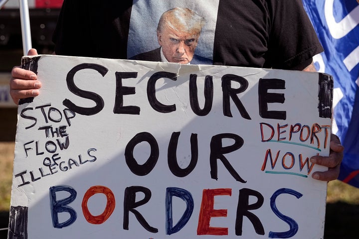 FILE - Phill Cady wears a t-shirt with a photo of former President Donald Trump as he holds a sign during a "Take Our Border Back" rally on Feb. 3, 2024, in Quemado, Texas. (AP Photo/Eric Gay, File)