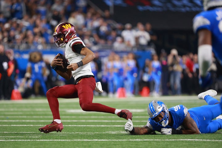 DETROIT,MICHIGAN-January 18: Washington Commanders quarterback Jayden Daniels #5 carries the ball during the second half of an NFL Divisional Playoff game between the Washington Commanders and the Detroit Lions at Ford Field in Detroit, Michigan USA, on Saturday, January 18, 2025. (Photo by Jorge Lemus/NurPhoto via Getty Images)