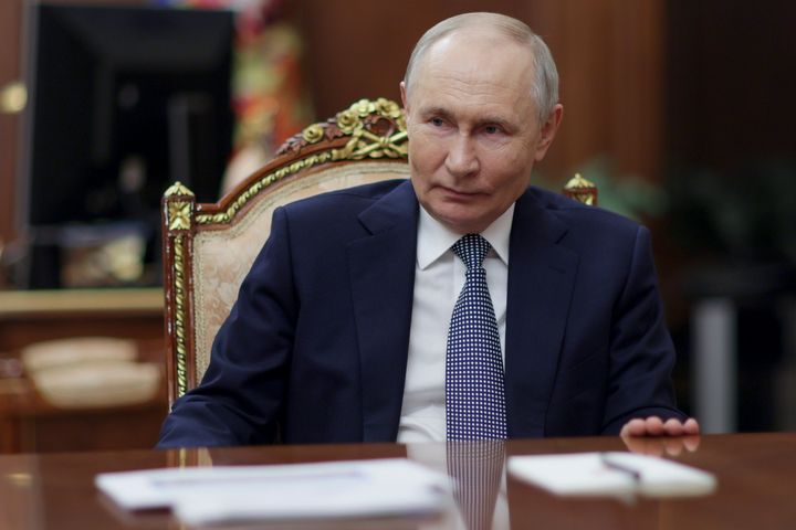 Russian President Vladimir Putin listens to President of the National Medical Research Centre for Endocrinology Ivan Dedov during their meeting at the Kremlin on Saturday.