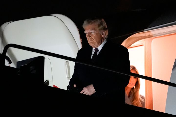 President-elect Donald Trump and Melania Trump, walk off an Air Force Special Mission airplane as they arrive at Dulles International Airport, Saturday, Jan. 18, 2025, in Dulles, Va. (AP Photo/Alex Brandon)