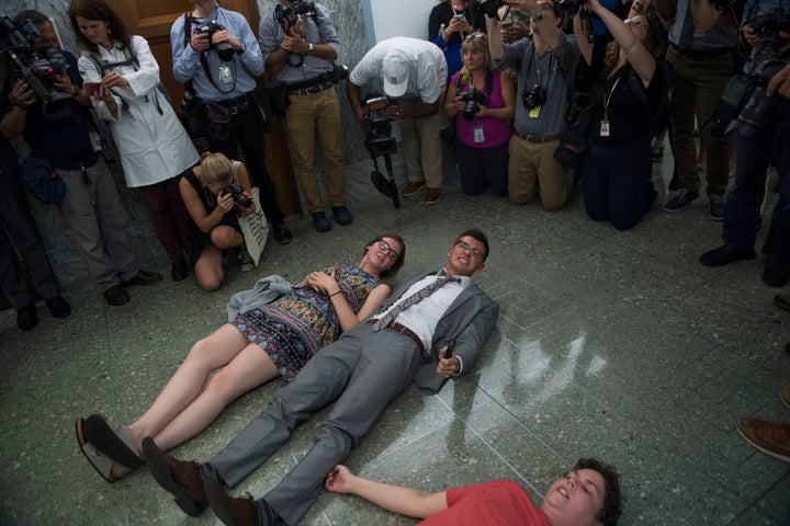 Protesters disrupt a Senate hearing on repealing the Affordable Care Act in September 2017. The failed effort to overturn the law helped cost Republicans control of the House.