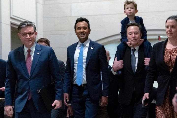 Vivek Ramaswamy (second from left) and Elon Musk (second from right) arrive on Capitol Hill for a meeting about DOGE. Their immigration views have angered some of the MAGA faithful.