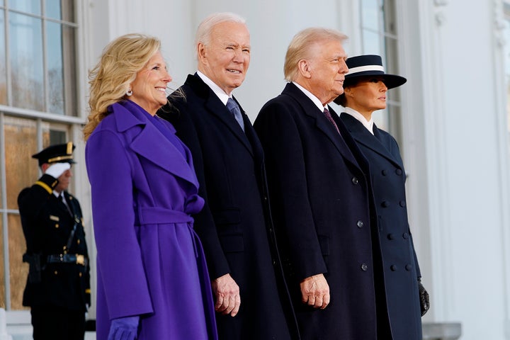 Jill Biden’s purple coat is a symbol of bipartisanship. For her last day in office, she was reportedly outfitted in monochromatic blue. Melania Trump wears a navy blue coat with a coordinating boater-style hat that obscures her eyes.