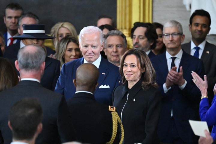 For Harris’ indoor look, she wears a boxy black suit, as if to convey she’s in mourning.