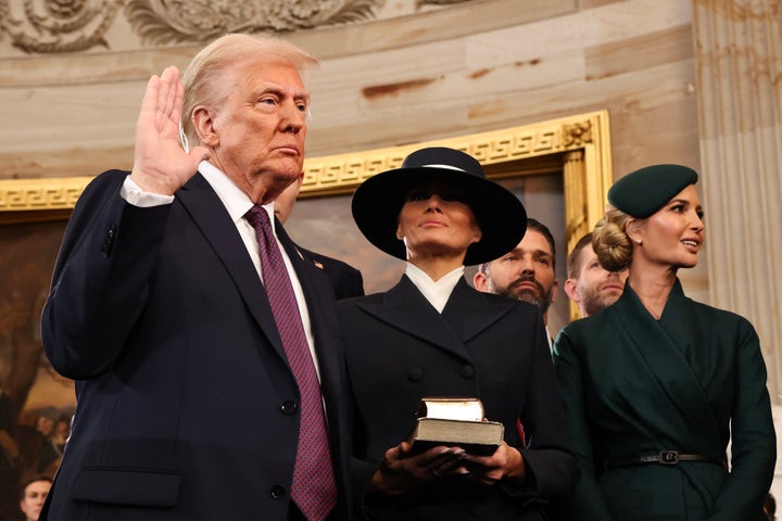 Donald Trump takes the oath of office as his wife Melania and children look on at the U.S. Capitol on Jan. 20, 2025. 