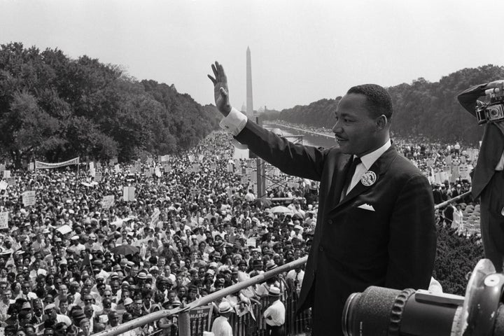 Martin Luther King Jr. waves to supporters at the 1963 rally where he delivered his famous "I Have a Dream" speech. Trump's racism would have been anathema to King.