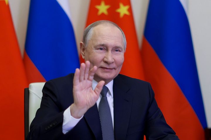 Russian President Vladimir Putin, gestures as he speaks with Chinese President Xi Jinping via videoconference at Novo-Ogaryovo state residence outside of Moscow, Russia, Tuesday, Jan. 21, 2025. 