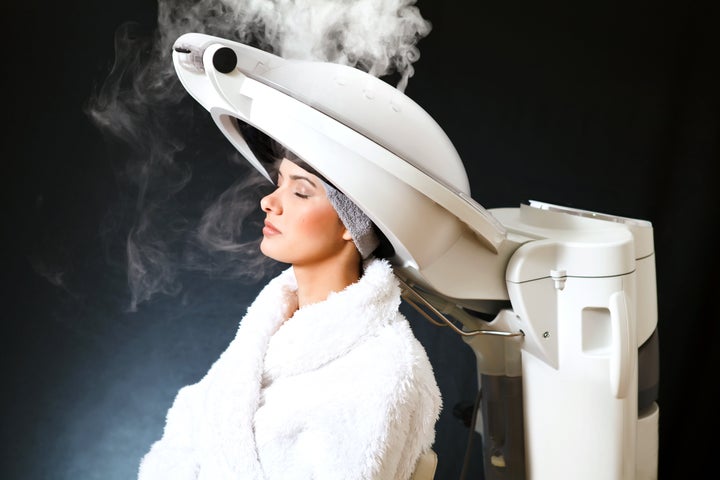 During treatment, you’re placed under a hair steamer, which releases moist heat for anywhere from five minutes to an hour.