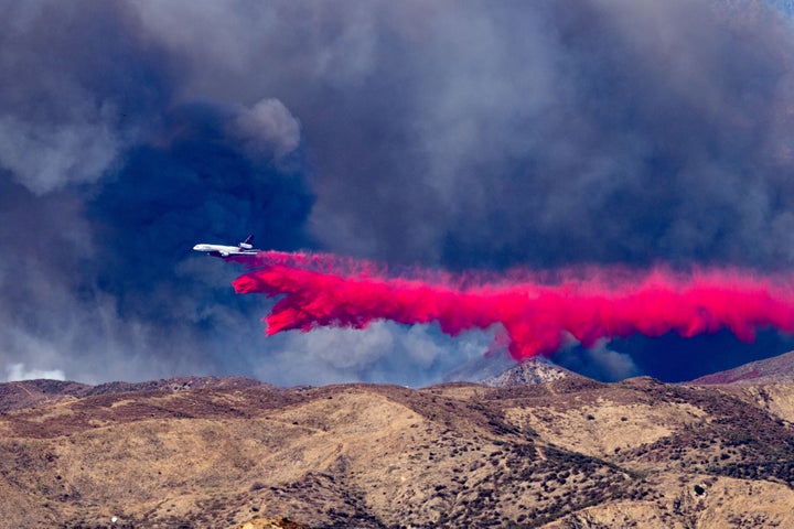 Tankers drop Phos-Chek on the front edge of the Hughes fire in Castaic, CA on Wednesday, January 22, 2025.