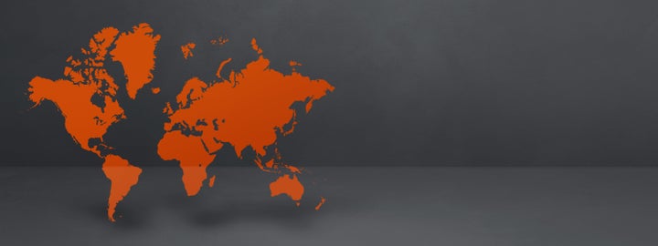 Orange world map isolated on black concrete wall background. 3D illustration. Horizontal banner