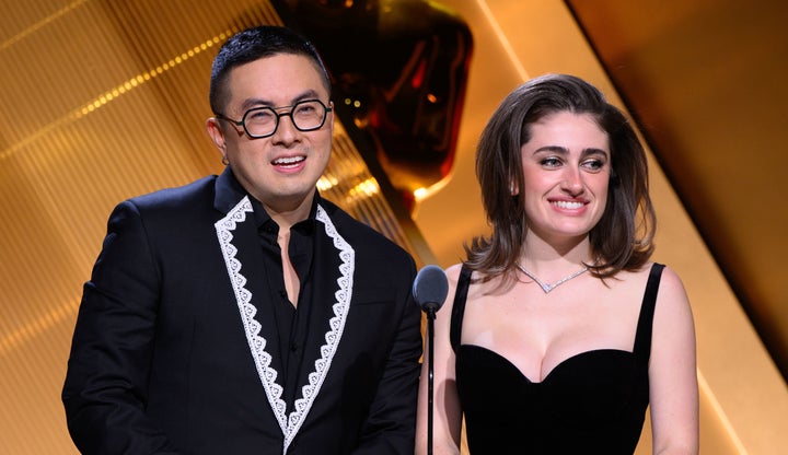In this handout photo provided by the Academy of Motion Picture Arts and Sciences, Bowen Yang (left) and Rachel Sennott announce the nominees for the 97th Academy Awards onstage at the Samuel Goldwyn Theater.