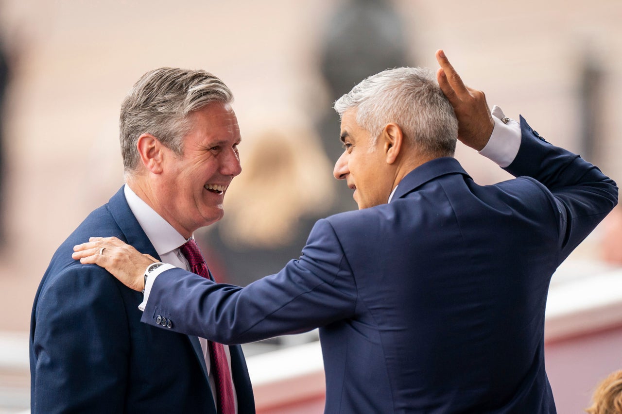 Labour leader Sir Keir Starmer, left, and Mayor of London Sadiq Khan chat as they attend the Platinum Jubilee Pageant in London, Sunday June 5, 2022.