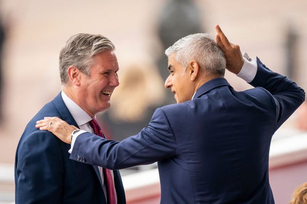 Labour leader Sir Keir Starmer, left, and Mayor of London Sadiq Khan chat as they attend the Platinum Jubilee Pageant in London, Sunday June 5, 2022.