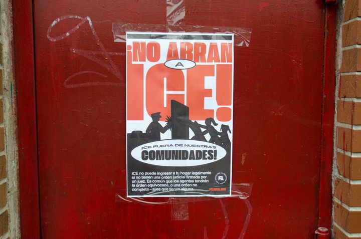 Posters plastered in a predominantly Mexican neighborhood in Chicago warn residents of ICE raids, emphasizing 'DON'T OPEN ICE! ICE OUT OF OUR COMMUNITIES!' on Jan. 22.