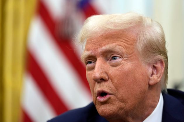 President Donald Trump speaks to reporters as he signs executive orders in the Oval Office of the White House, Thursday, Jan. 23, 2025, in Washington.