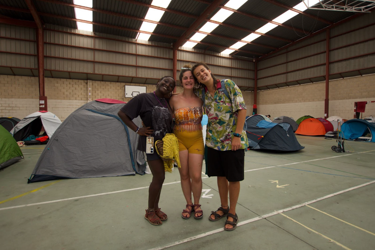 Candela (left,) Celia (Center) and Branca (right) admire how attendees are taking care of the shared spaces in the self-managed festival.