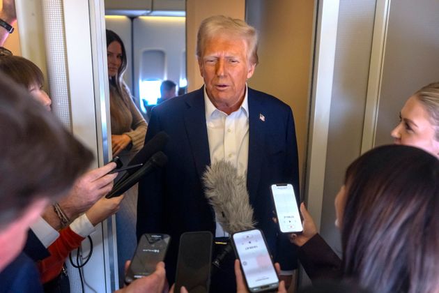 President Donald Trump speaks to reporters aboard Air Force One as he travels from Las Vegas to Miami on Saturday, Jan. 25, 2025. 