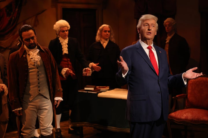 Special guest Lin-Manuel Miranda stood frozen behind "Saturday Night Live" James Austin Johnson as he delivered his first impersonation of President Donald Trump since his inauguration on Monday.