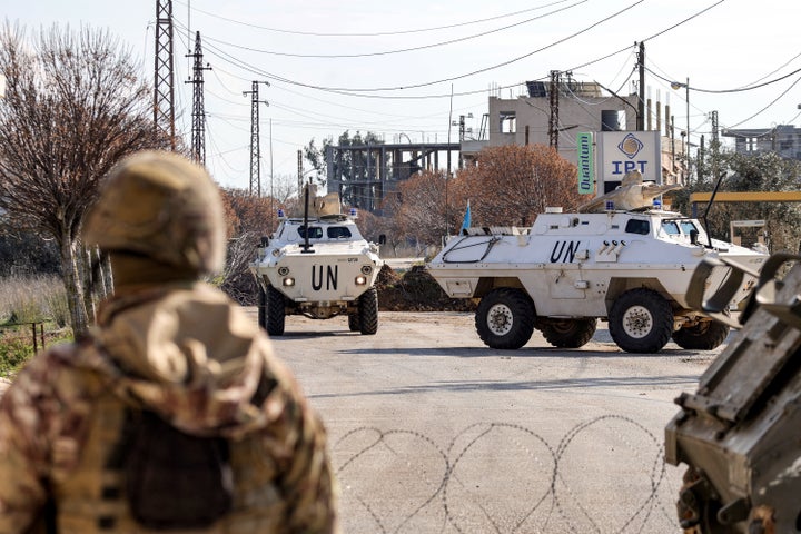 Armored vehicles belonging to the United Nations Interim Force in Lebanon (UNIFIL) approach a Lebanese army roadblock near a checkpoint in the village of Burj el-Meluk, in southern Lebanon's Nabatiyeh near the border with Israel on Jan. 25, 2025.