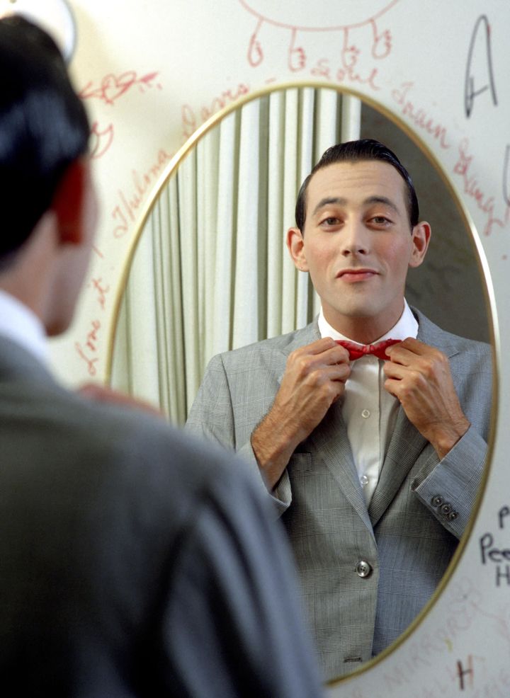 Reubens poses for a portrait in character as Pee-wee Herman in May 1980. The star came out as gay in the posthumous documentary "Pee-wee as Himself."