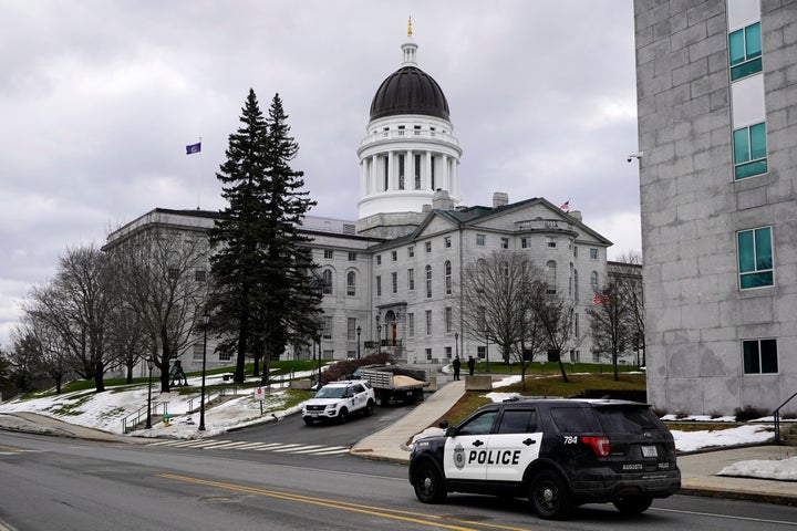 Capitol Police and Augusta Police patrol the State House grounds, on Sunday, Jan. 17, 2021, in Augusta, Maine. (AP Photo/Robert F. Bukaty)