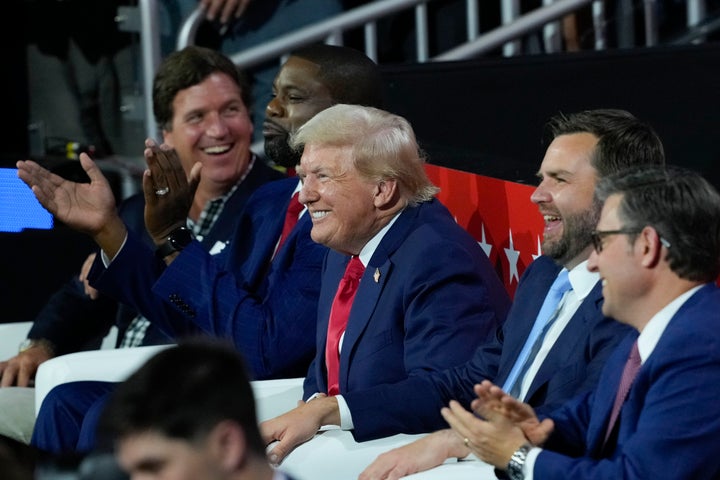 Tucker Carlson (left) with Donald Trump and JD Vance at the Republican National Convention last summer.