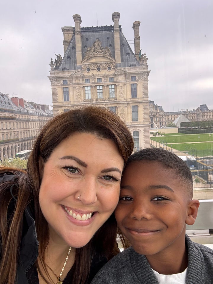 The author and one of her sons share a moment near the Louvre in Paris in November 2024.