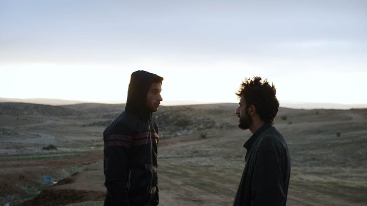 Adra (left) and his friend and co-director Yuval Abraham (right), an Israeli journalist. Over the course of the documentary, the two team up to try to raise awareness of the Israeli government's forced expulsions of Palestinians in the region of Masafer Yatta.