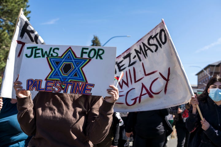 A student holds a placard reading "Jews for Palestine" during a pro-Palestine protest at the University of Nevada Reno on May 8, 2024.