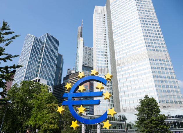 Frankfurt, Germany - looking up at city buildings. Euro symbol