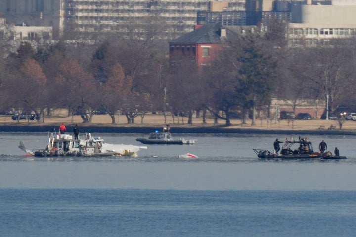 Search and rescue efforts are seen around a wreckage site in the Potomac River near Ronald Reagan Washington National Airport early Thursday morning.