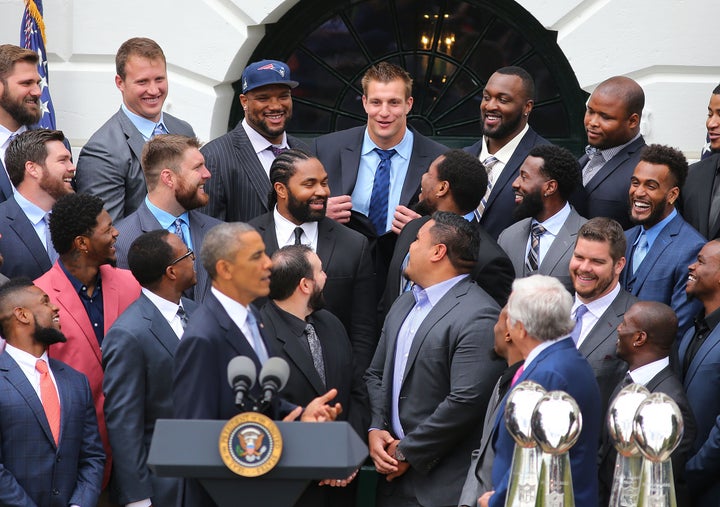 Rob Gronkowski pretends to take his shirt off as President Barack Obama singles him out in the crowd of Patriot players in 2015.