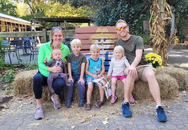 The author, her husband and their four kids at the zoo in October 2024.