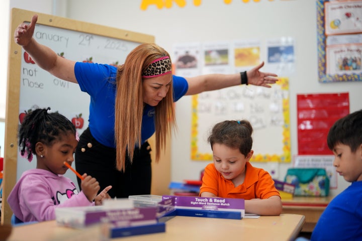 Teacher Grismairi Amparo works with her students on a reading and writing lesson at Head Start program run by Easterseals South Florida, an organization that gets about a third of its funding from the federal government, on Jan. 29 in Miami.