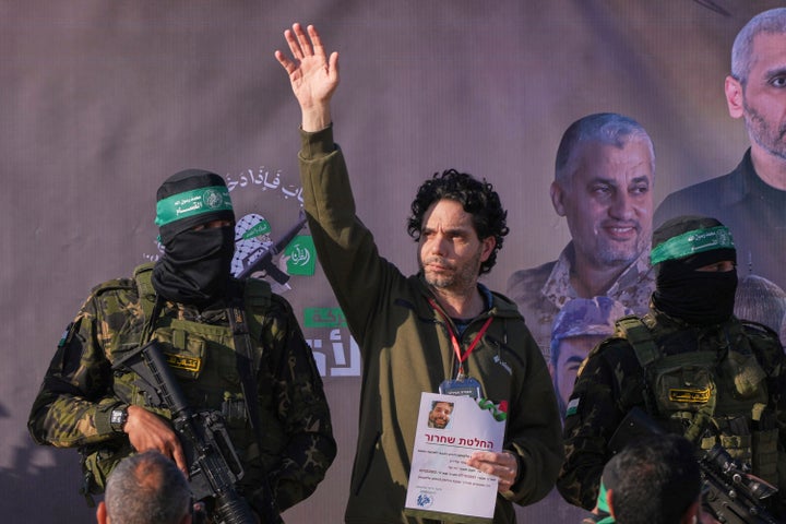 Israel Frees Dozens Of Palestinian Prisoners, Hamas Releases 3 Hostages In Newest Swap 2 Israeli Ofer Kalderon who has been held hostage by Hamas in Gaza since October 7, 2023, waves before being handed over to the Red Cross by Hamas fighters in Khan Younis, southern Gaza Strip, Saturday Feb. 1, 2025. Photo/Abdel Kareem)