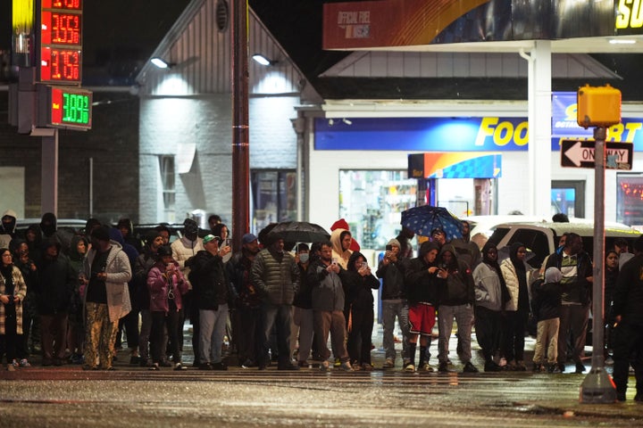 Bystanders watch as first responders work the scene.