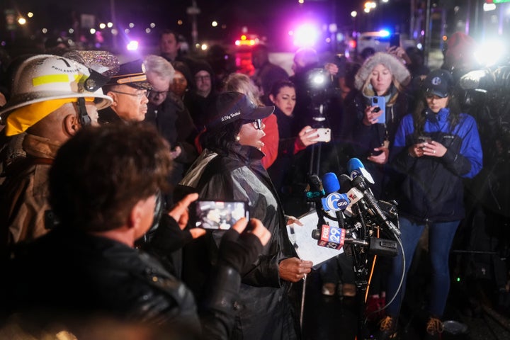 Philadelphia Mayor Cherelle Parker, center, speaks during a news conference on Friday.