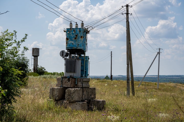 Concrete electrical poles provided by the United States Agency for International Development replace some poles damaged by war, and are strung with new cable, as Ukrainians grapple with severe electricity shortages as Russia targets electrical infrastructure across the country, on July 17, 2024 in Balakliia, Ukraine. (Photo by Scott Peterson/Getty Images)