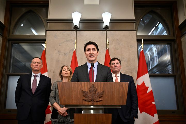 Justin Trudeau deals with the media on February 1, 2025, after imposing a tariff on US President Donald Trump on Canada, Mexico, and China on Saturday, February 1, 2025. The Secretary of State Melanie Jolly and Dominic Leblanc are looking at the Secretary of State. (Canadian media through Justin Tang/AP)