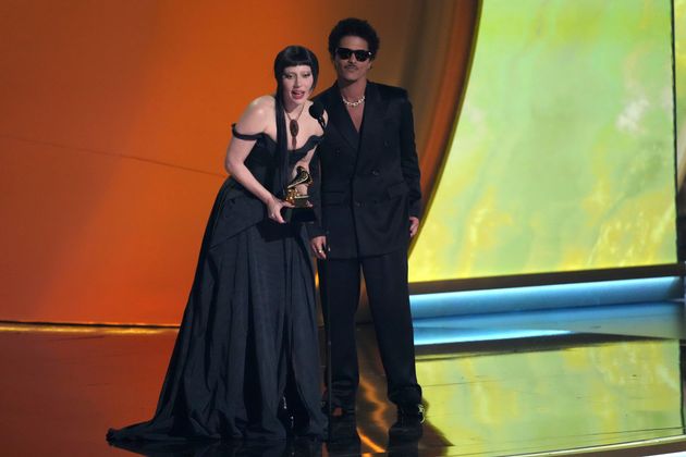 Lady Gaga and Bruno Mars accepting an award at the 2025 Grammys