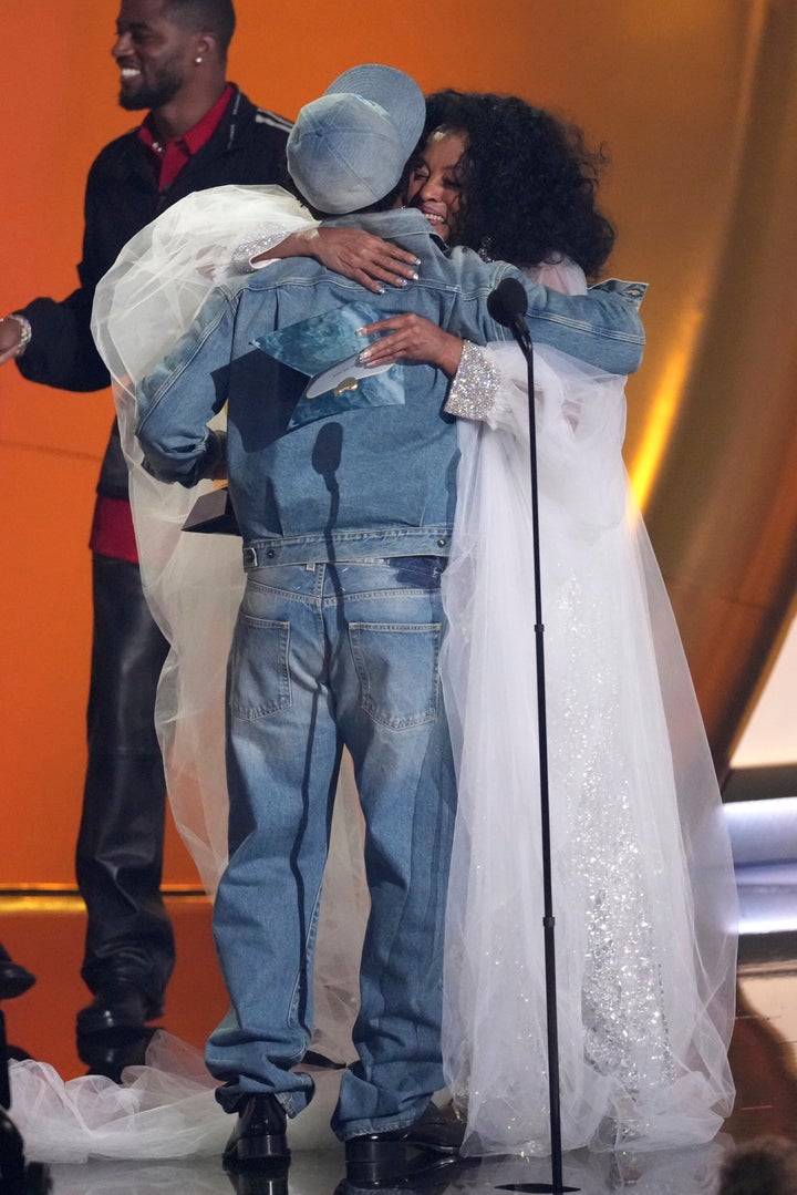 Kendrick Lamar and Diana Ross share an embrace on stage at the Grammys