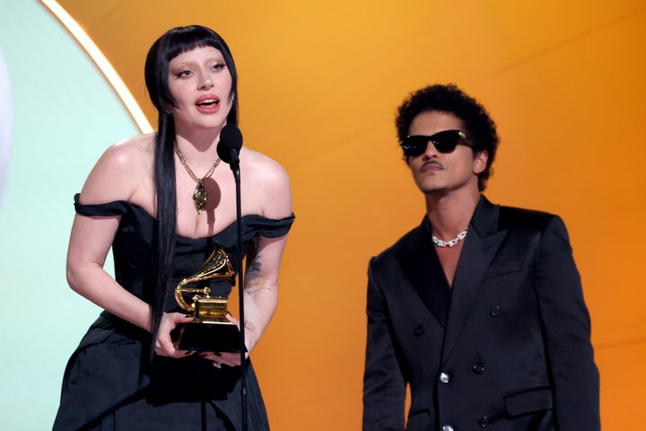 LOS ANGELES, CALIFORNIA - FEBRUARY 02: (L-R) Lady Gaga and Bruno Mars speak onstage during the 67th Annual GRAMMY Awards at Crypto.com Arena on February 02, 2025 in Los Angeles, California. (Photo by Kevin Mazur/Getty Images for The Recording Academy)