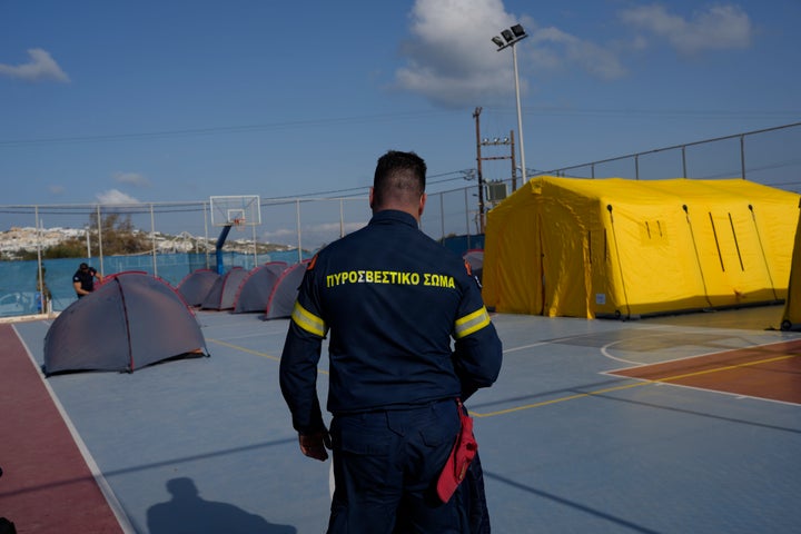Emergency Crews Deployed On Popular Greek Island As Earthquake Swarm Worries Experts 2 A firefighter walks next to tents set up at a basketball court to accommodate Fire Service rescuers as Greek authorities is taking emergency measures in response to intense seismic activity on the popular Aegean Sea holiday island of Santorini, southern Greece, on Feb. 3, 2025.