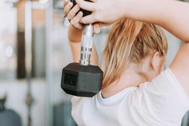 Woman lifting dumbbell