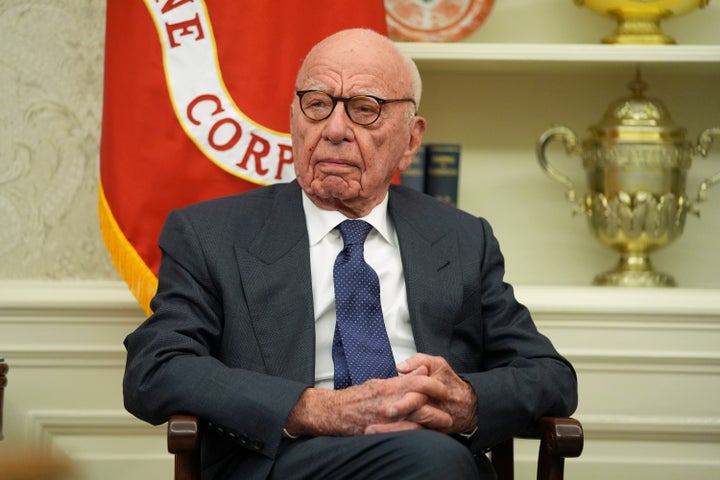 Rupert Murdoch sits in the Oval Office on Monday as President Donald Trump signs an executive order.