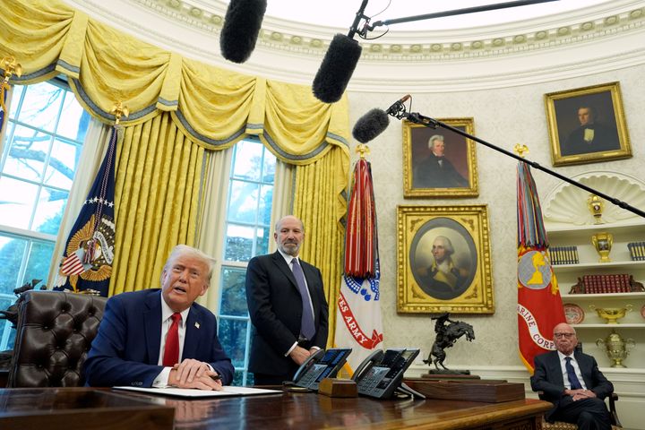 Donald Trump speaks Monday as Howard Lutnick, his nominee for commerce secretary, and former Fox Corp. chair Rupert Murdoch join him in the White House Oval Office.