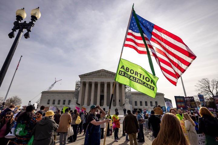 Demonstrators protest and argue about abortion rights outside the U.S. Supreme Court. On Tuesday, the same justices who reversed the constitutional right to abortion two years ago will hear arguments on whether to limit the use of mifepristone, a medication that's used in nearly two-thirds of abortions nationally.