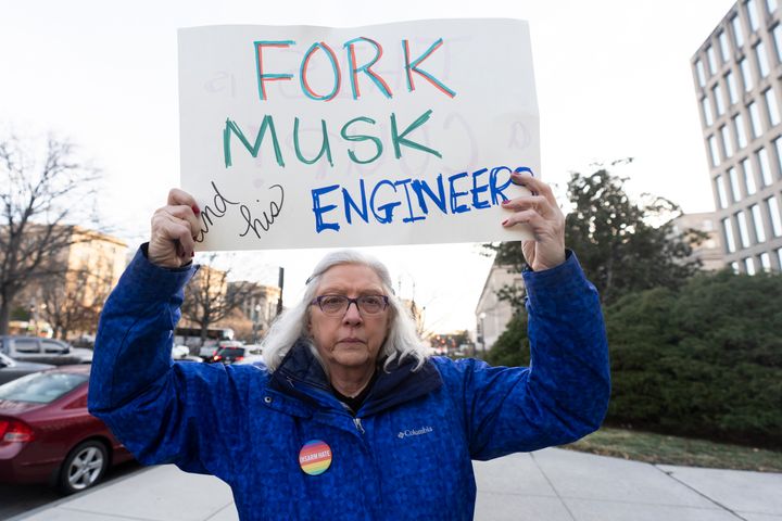 A protester rallies in front of the Office of Personnel Management on Feb. 3, 2025, in Washington. President Donald Trump is relying on a relatively obscure federal agency to reshape government. The Office of Personnel Management was created in 1979 by President Jimmy Carter and is the equivalent of the government's human resources department. It helps manage the civil service, including federal employees' pay schedules, health insurance and pension programs. The agency has offered millions of federal workers eight months of salary if they voluntarily choose to leave their jobs by Feb. 6. 